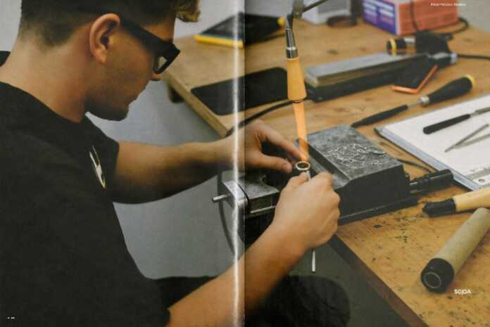 Goldsmith shortage Canada — apprentice bench jeweller filing a gold ring