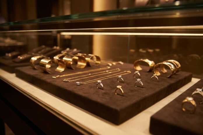 Richemont jewellery sales strength shown in a warm gold fine jewellery boutique display
