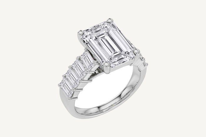 SK Diamonds Time and Shine Toronto emerald cut diamond ring in white gold with graduated step cut sidestones